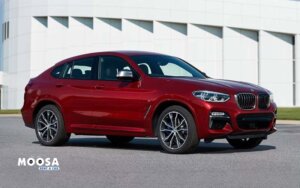 A red BMW X4 2019 standing front side