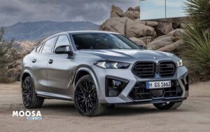 Grey BMW X6 M Competition standing in sands