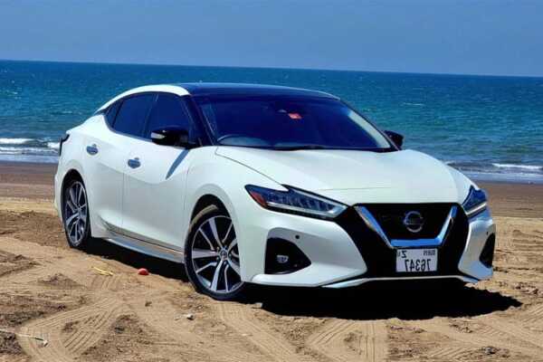 2020 Nissan Maxima available for rent in Dubai, showcasing its elegant design and luxurious interior, perfect for travelers seeking comfort and style.